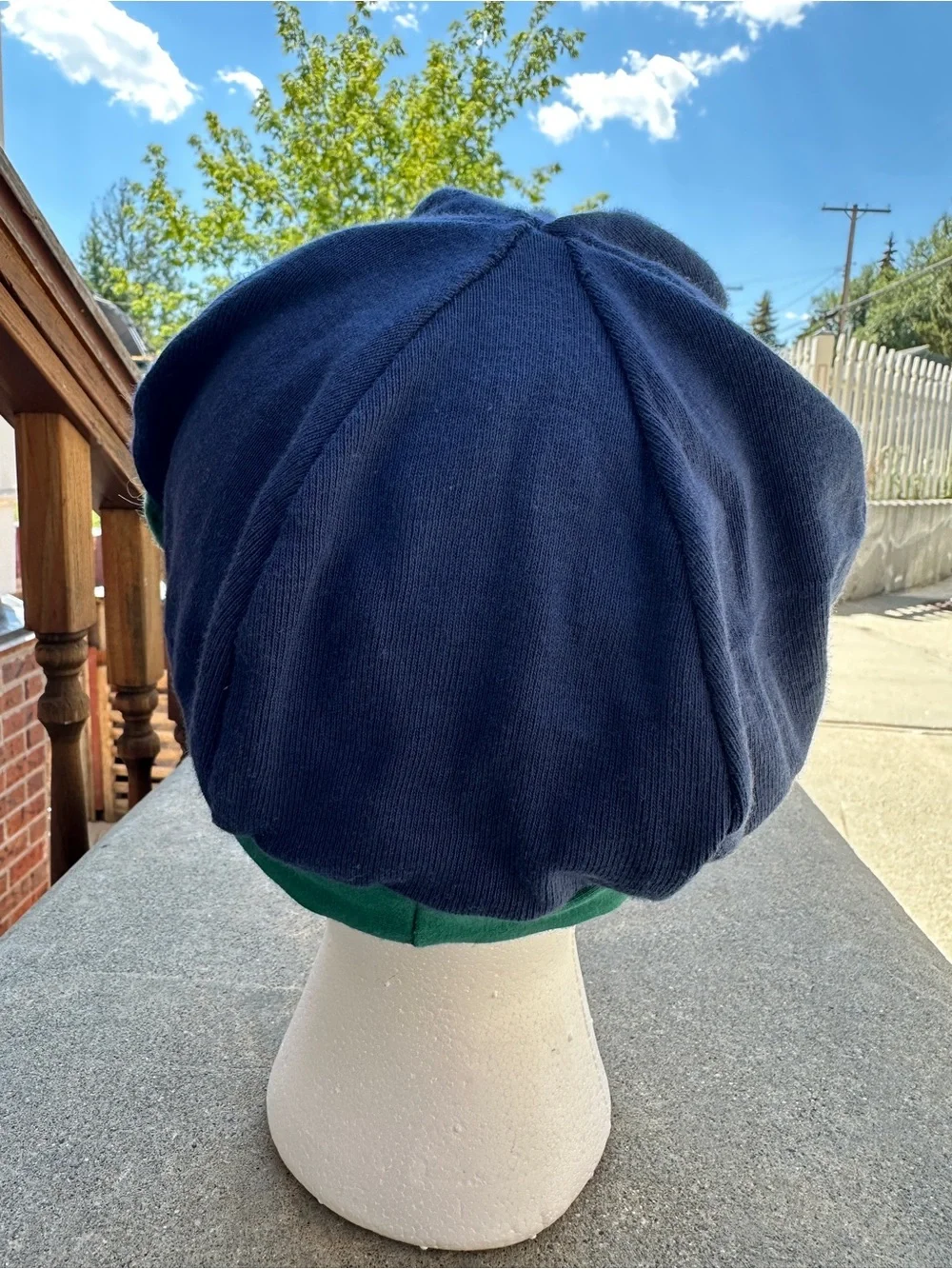 Cotton blend stretch cap baseball style hat navy green flower accent